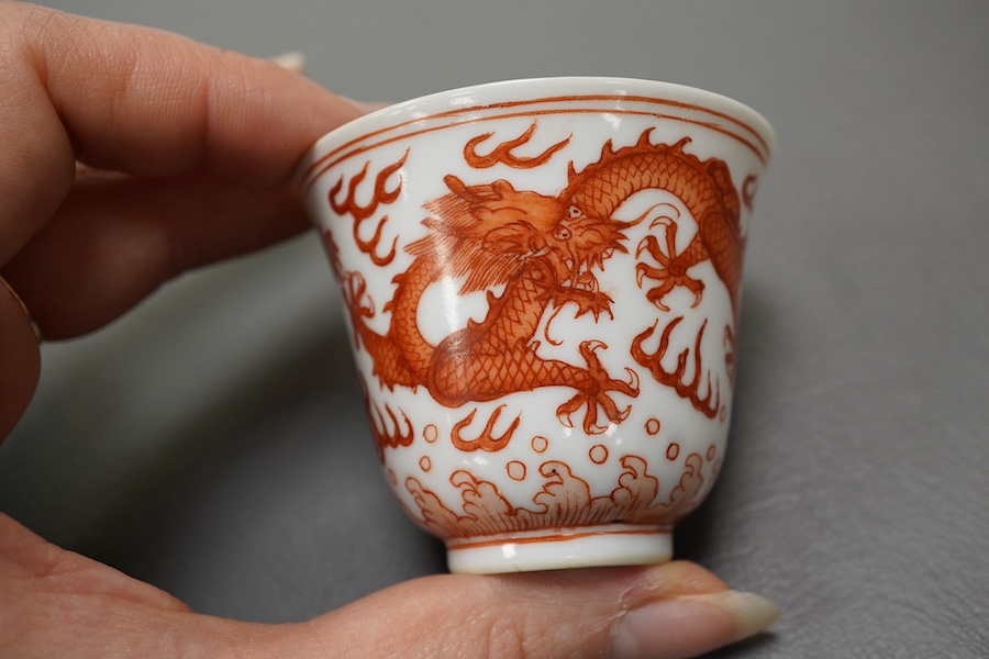 A pair of Chinese iron red ‘dragon’ cups, Guangxu six character mark and probably of the period (1875-1908)